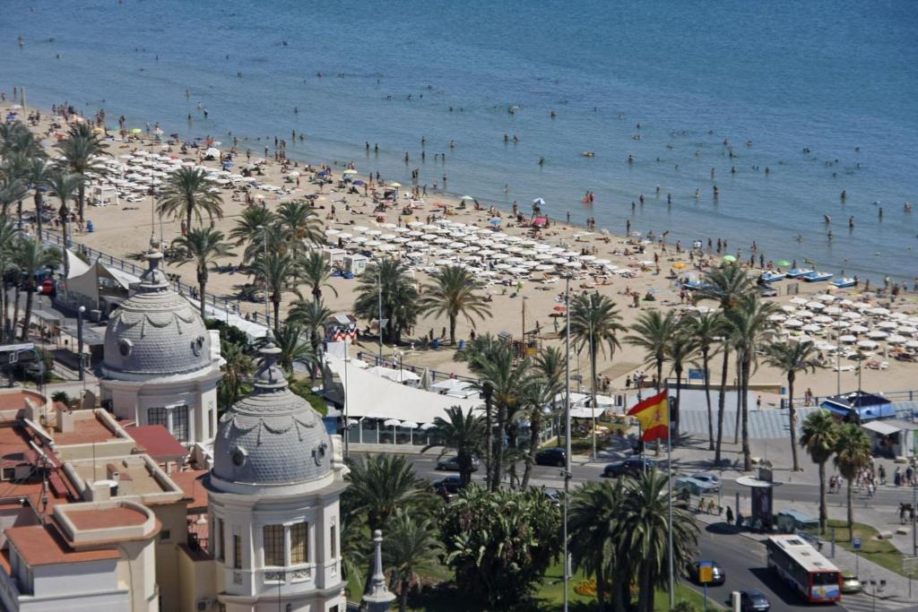 a view of a beach with a crowd of people at Agustina Apartment in Alicante