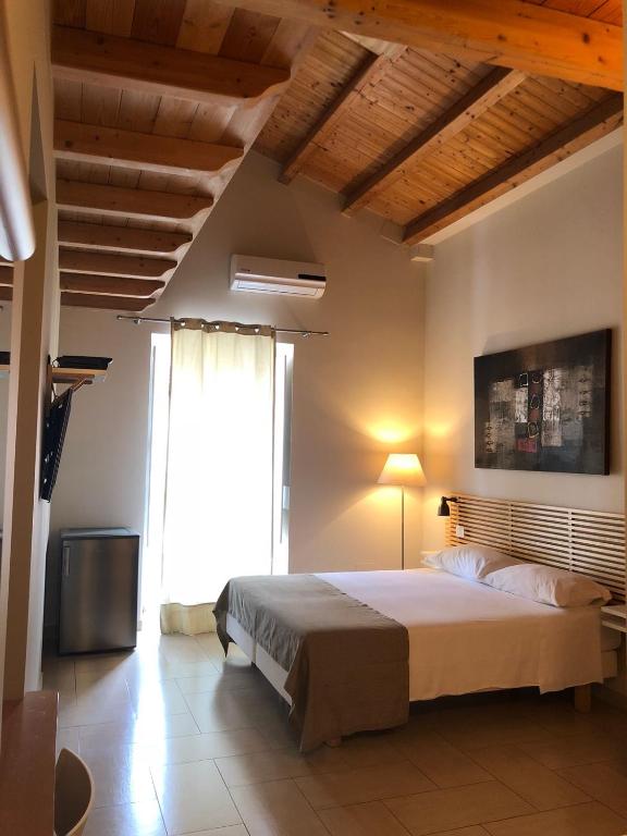 Postel nebo postele na pokoji v ubytování B&B Re Umberto
