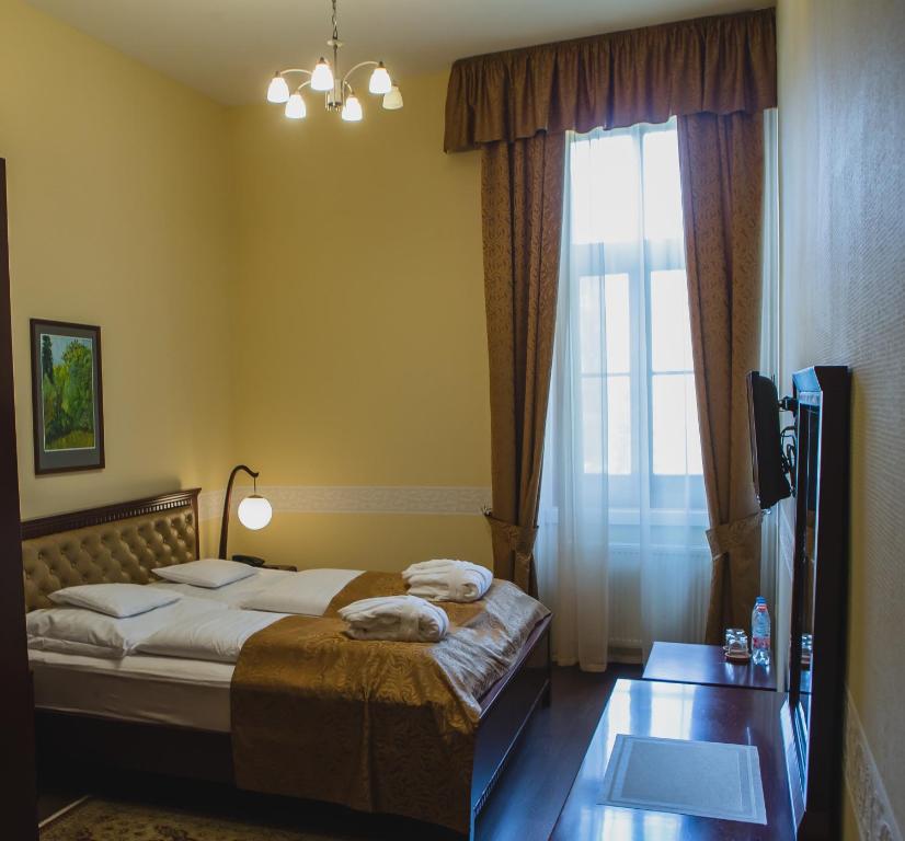 Posteľ alebo postele v izbe v ubytovaní Főnix Wellness Resort