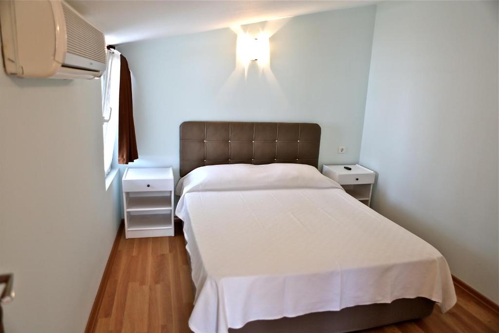 Postel nebo postele na pokoji v ubytování Erol Apart