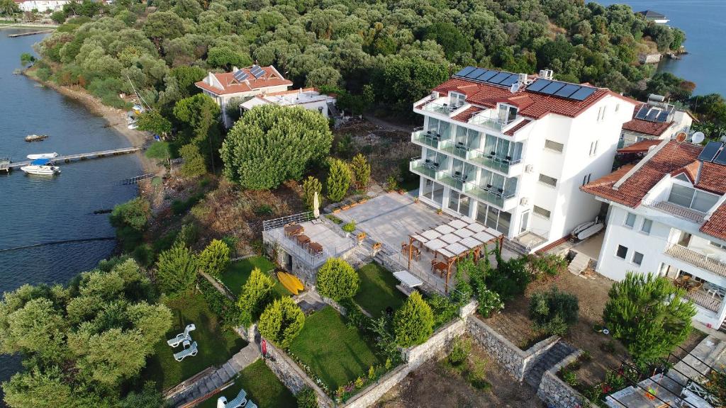 an aerial view of a large white building next to the water at Sovalye Hotel in Fethiye