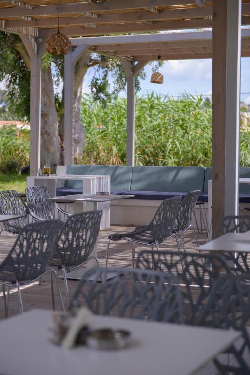 a group of chairs and tables on a patio at Argilos in Sidari