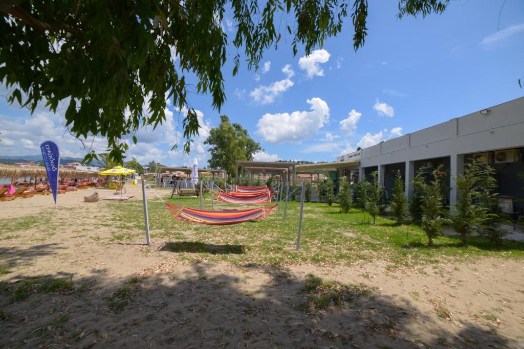 a group of hammocks in front of a building at Argilos in Sidari