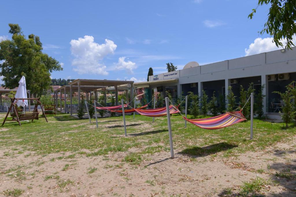 a group of hammocks in front of a building at Argilos in Sidari