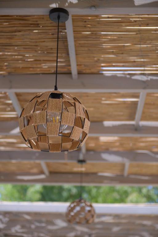 a chandelier hanging from a ceiling in a room at Argilos in Sidari