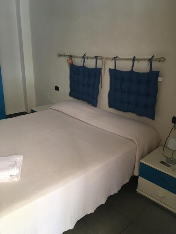 Postel nebo postele na pokoji v ubytování Residence La Quiete