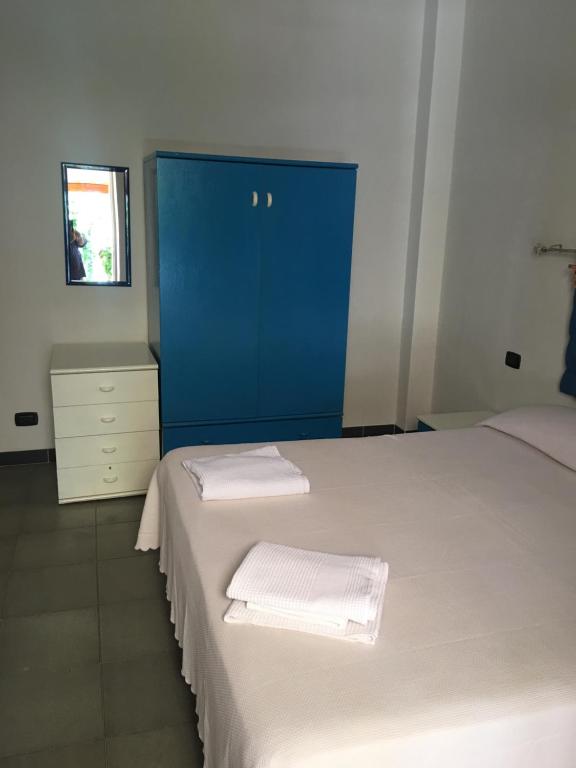 Postel nebo postele na pokoji v ubytování Residence La Quiete