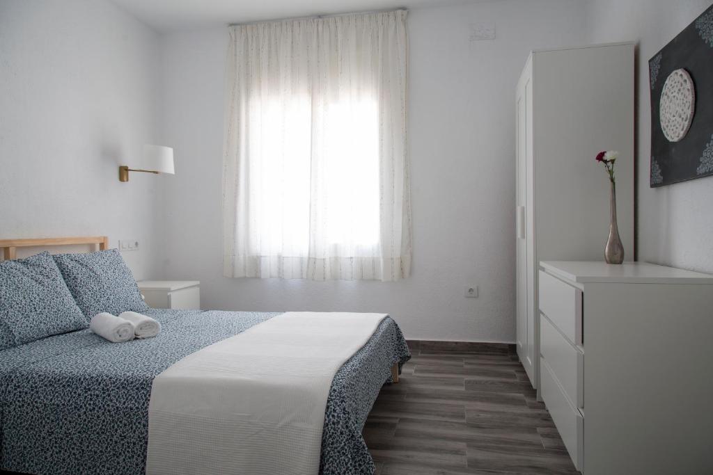 A bed or beds in a room at Home Family