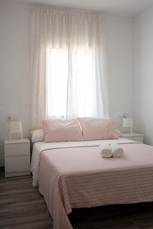 A bed or beds in a room at Home Family