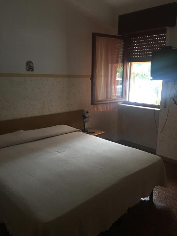 Postel nebo postele na pokoji v ubytování Residence La Quiete