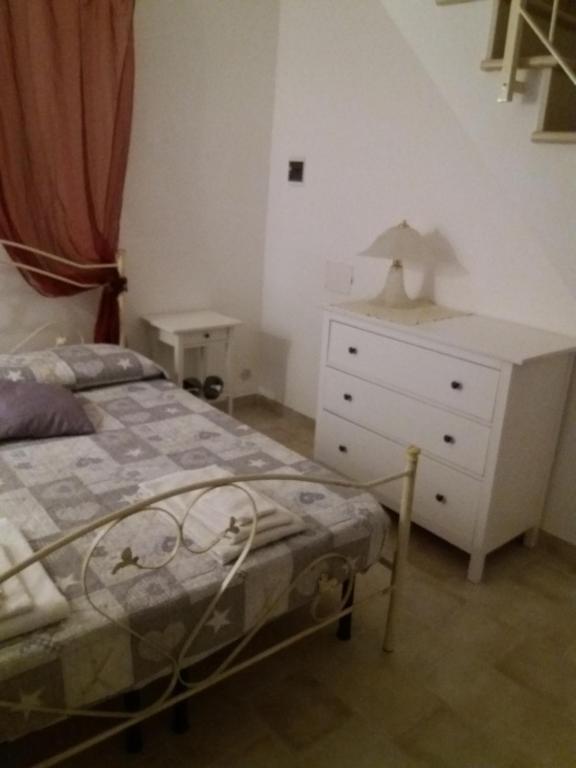 Postel nebo postele na pokoji v ubytování Il rifugio del conte