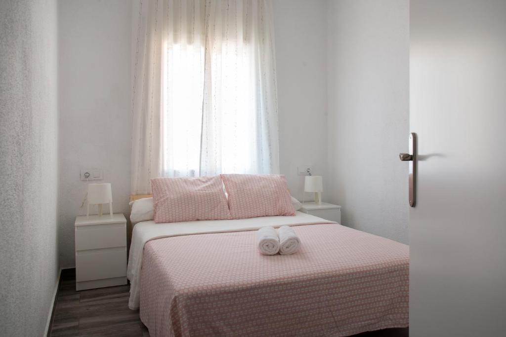 A bed or beds in a room at Home Family