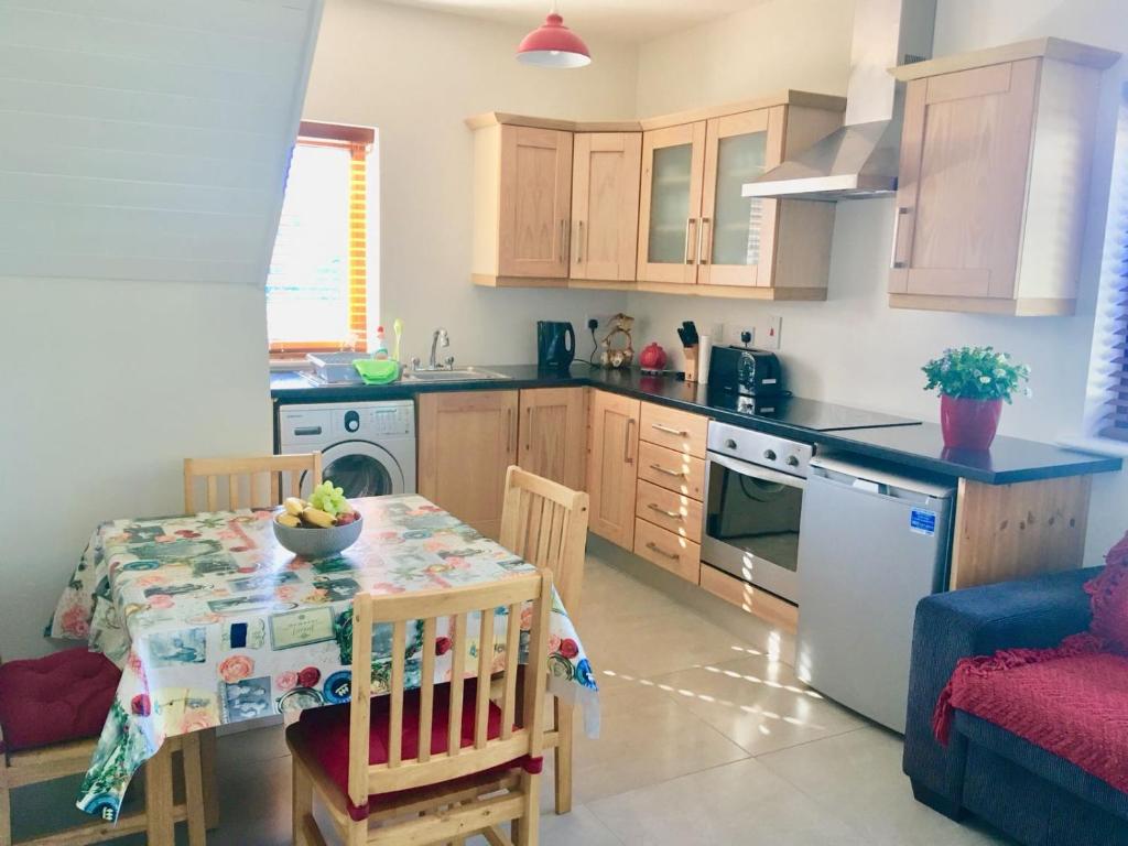 a kitchen with a table and a dining room at Meadow View in Trim