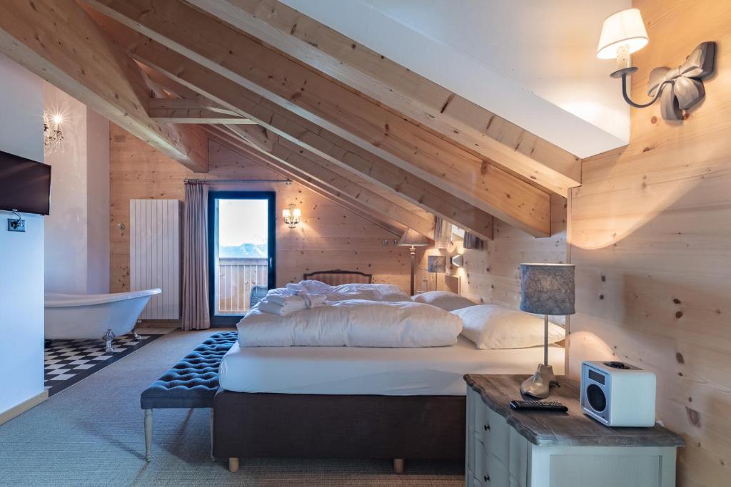 Postel nebo postele na pokoji v ubytování Rinderberg Lodge