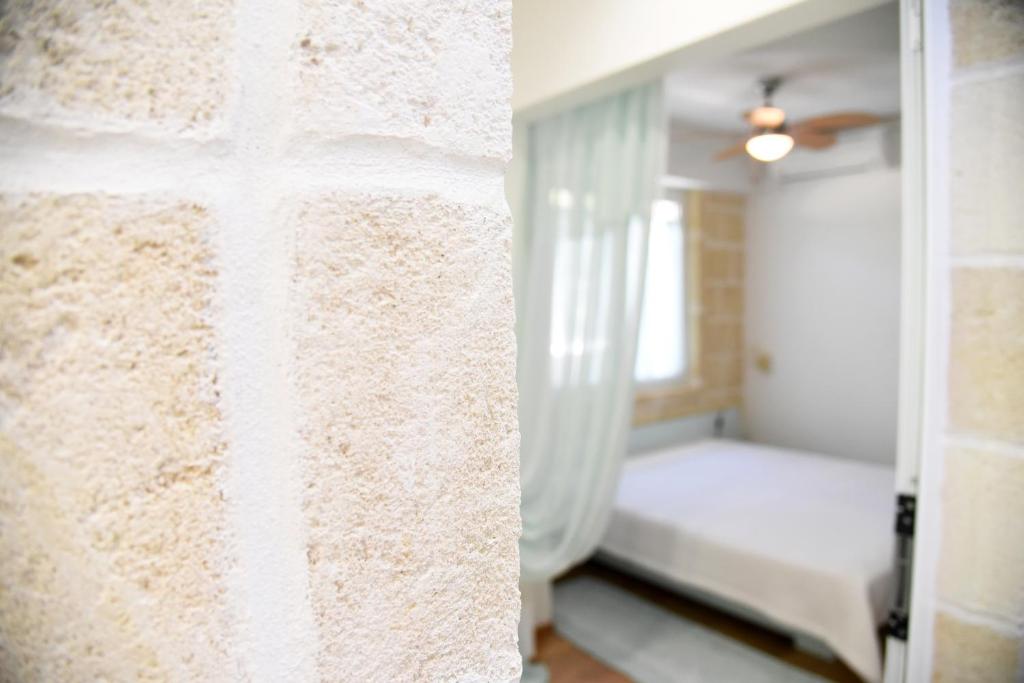 Postel nebo postele na pokoji v ubytování B&B Al Vecchio Glicine