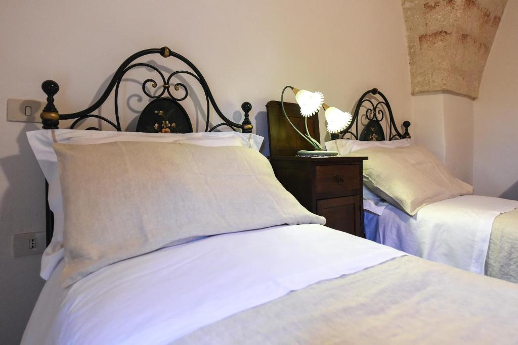 Postel nebo postele na pokoji v ubytování Masseria Lamiola Piccola
