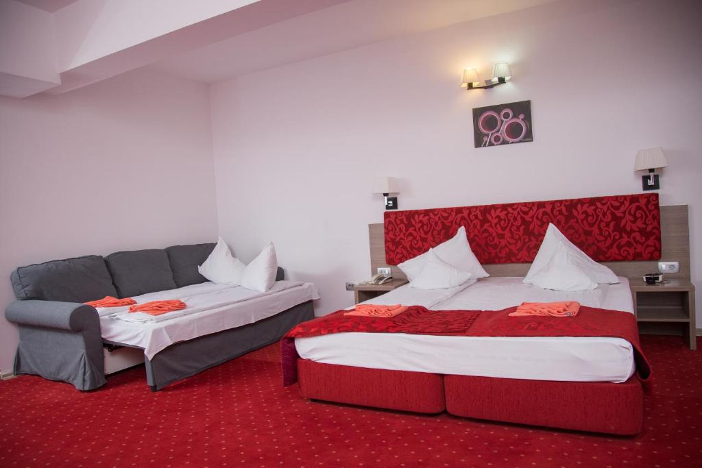 Postel nebo postele na pokoji v ubytování Hotel Tisa
