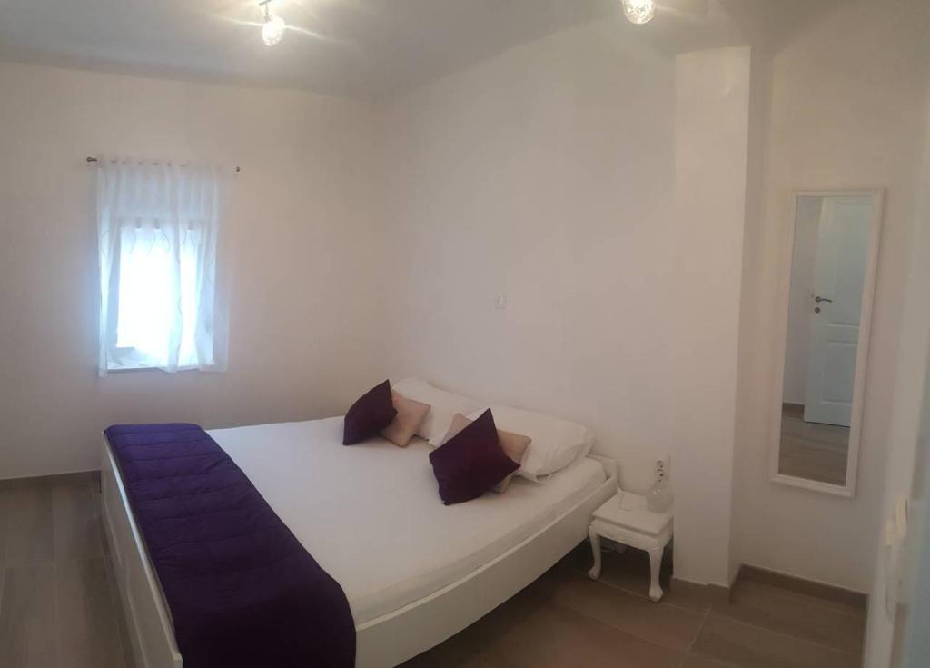 Postel nebo postele na pokoji v ubytování Apartments Rotim