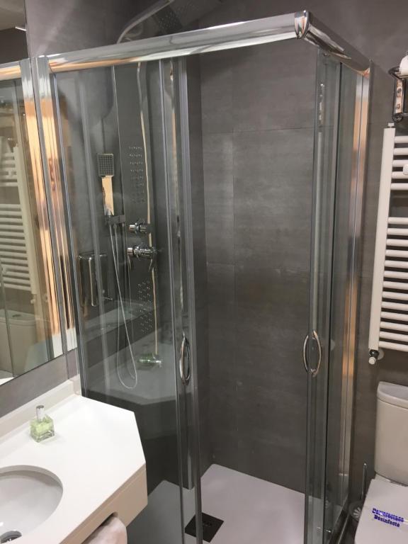 a bathroom with a shower and a sink at Rincón de Gran Vía in Madrid