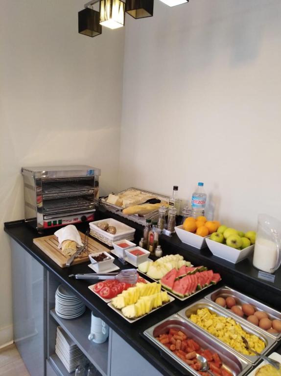 a buffet with many different types of fruits and vegetables at Rincón de Gran Vía in Madrid