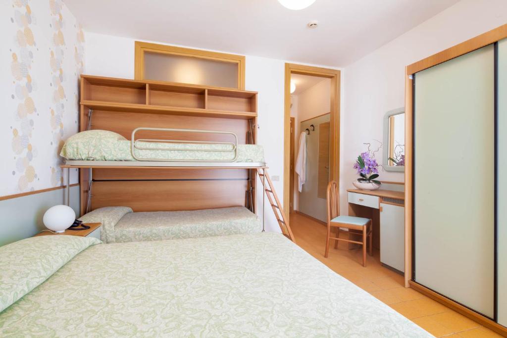 Postel nebo postele na pokoji v ubytování Hotel Universal