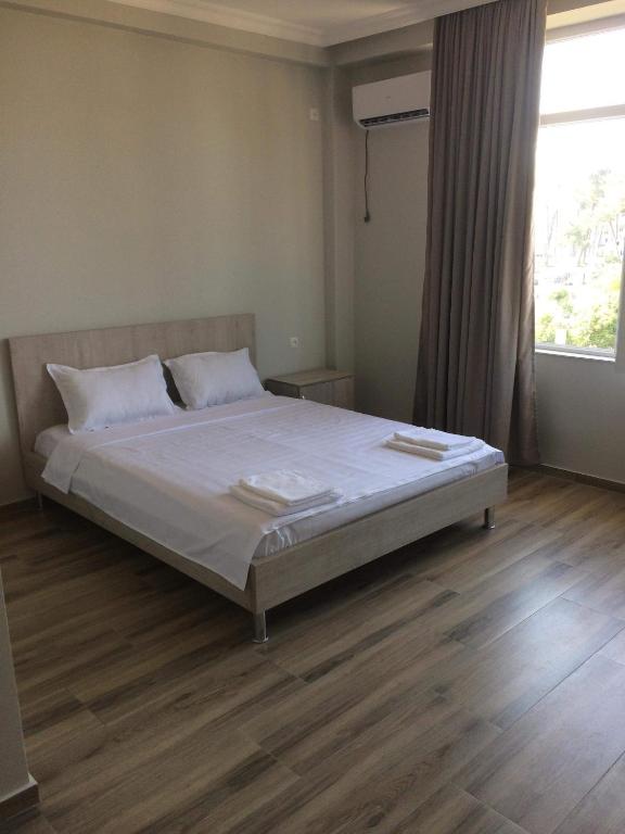 Postel nebo postele na pokoji v ubytování David Palace Hotel Ureki
