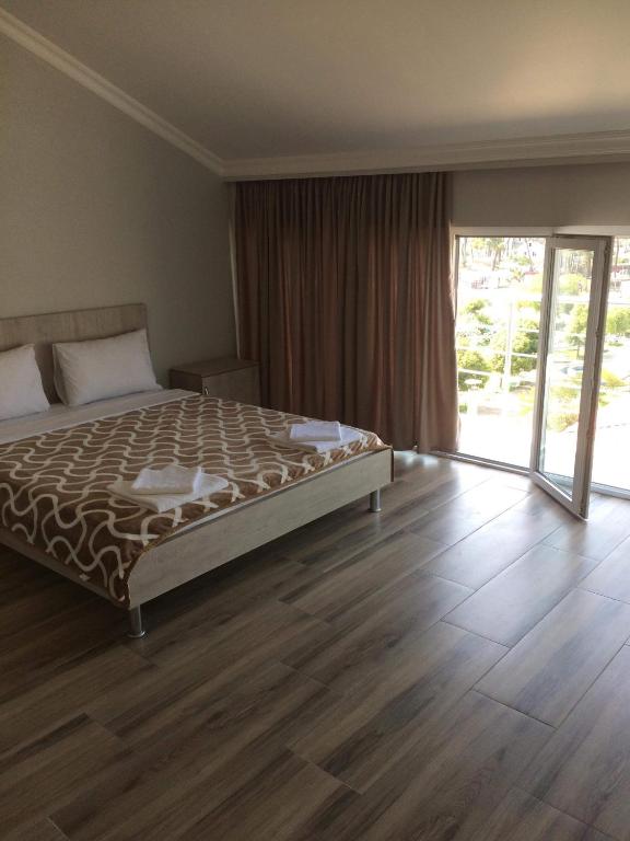 Postel nebo postele na pokoji v ubytování David Palace Hotel Ureki