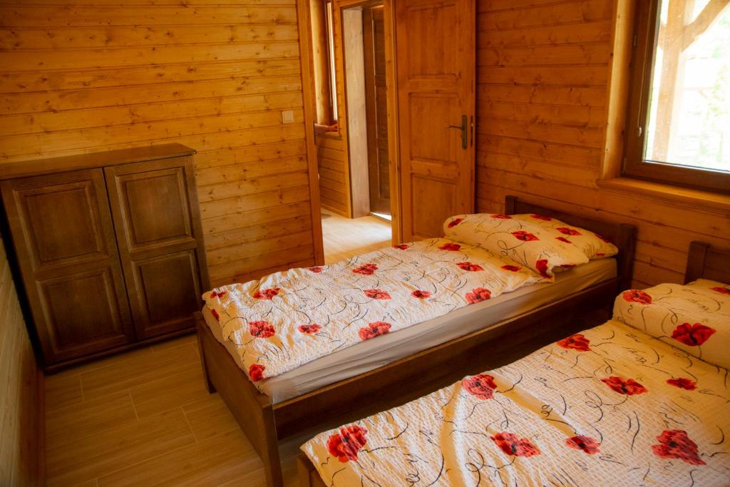 Postel nebo postele na pokoji v ubytování JANTAR Pokoje i Domki u Reni