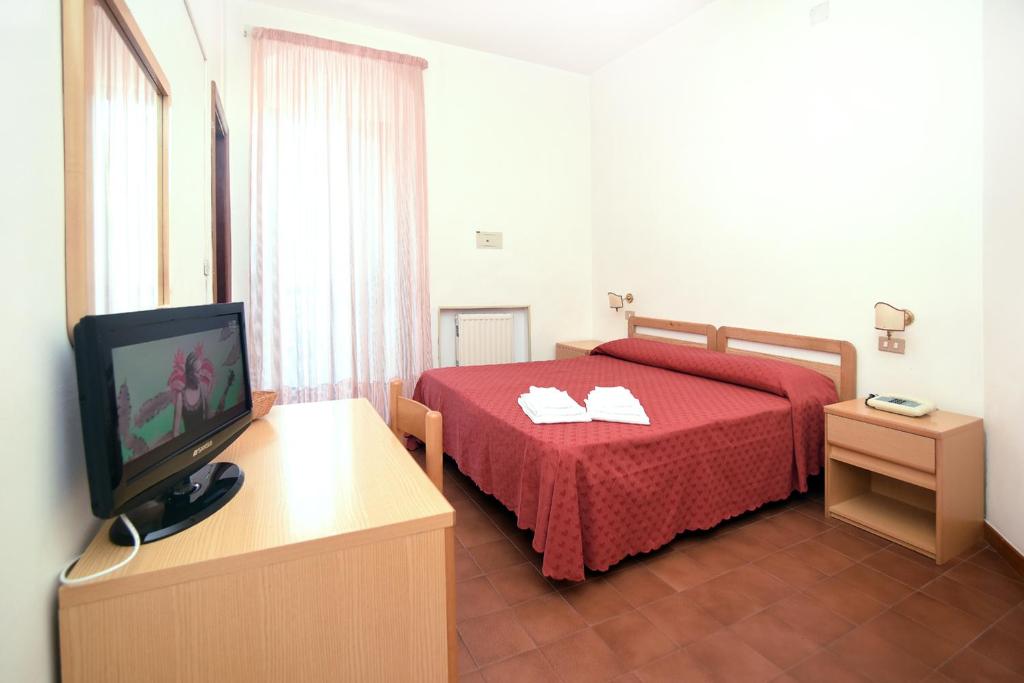 Ένα ή περισσότερα κρεβάτια σε δωμάτιο στο Hotel Timiama