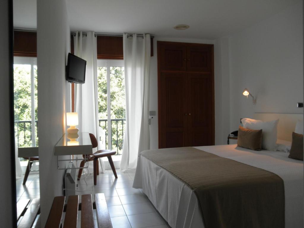 Кровать или кровати в номере Hotel Farsund