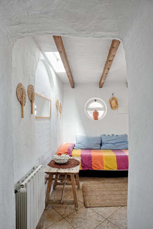 Postel nebo postele na pokoji v ubytování La Casa de Bovedas Charming Inn