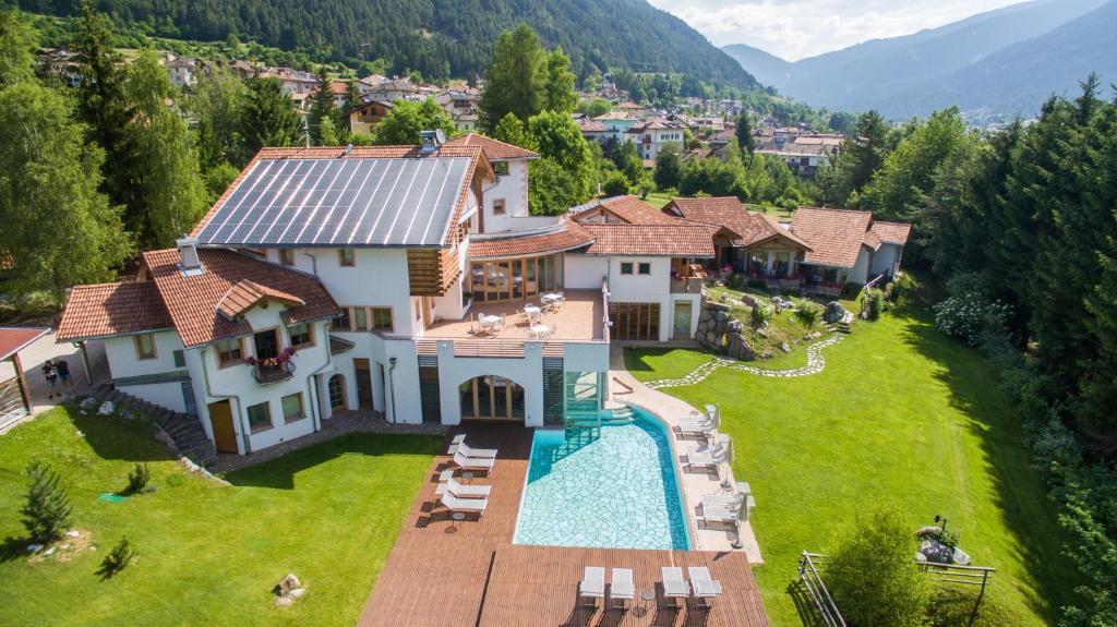 an aerial view of a house with a swimming pool at Castelir Suite Hotel in Panchià