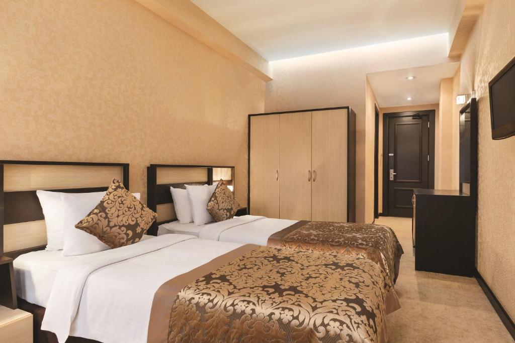 Postel nebo postele na pokoji v ubytování Days Hotel By Wyndham Baku