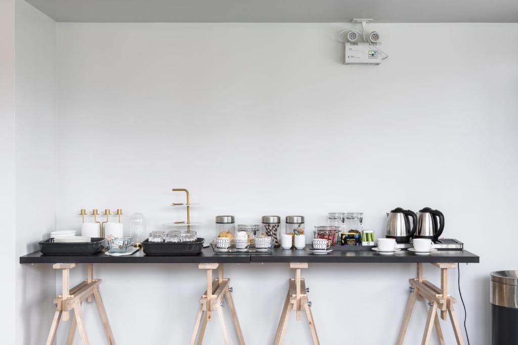 A self-service beverage and breakfast station arranged on a long counter.