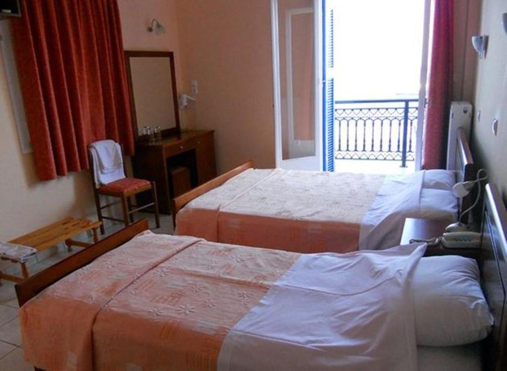 Postel nebo postele na pokoji v ubytování Apollon Hotel