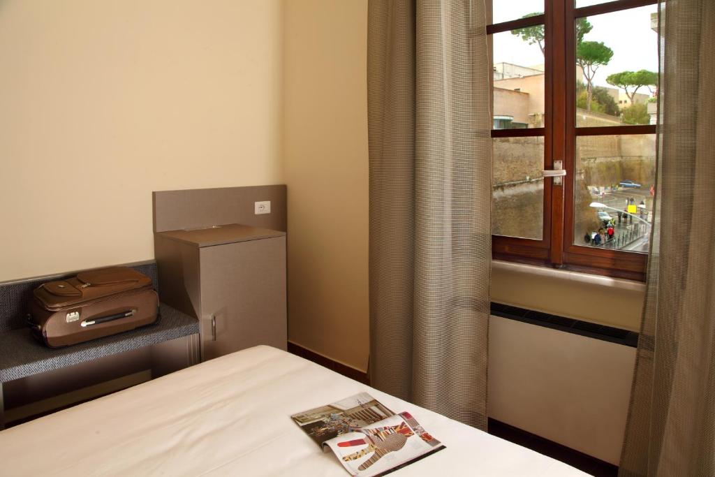 Postel nebo postele na pokoji v ubytování Hearth Hotel