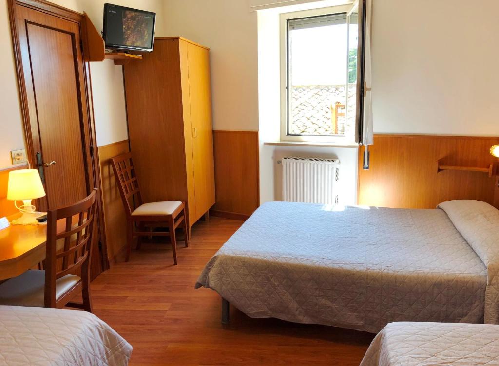 Postel nebo postele na pokoji v ubytování Hotel Signa