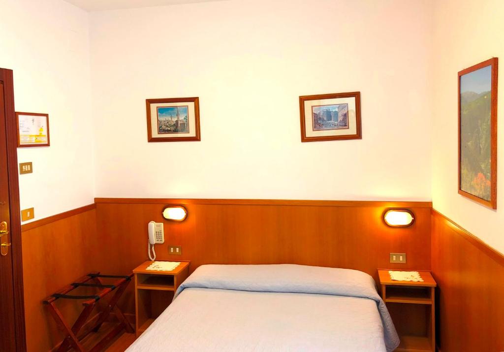 Postel nebo postele na pokoji v ubytování Hotel Signa