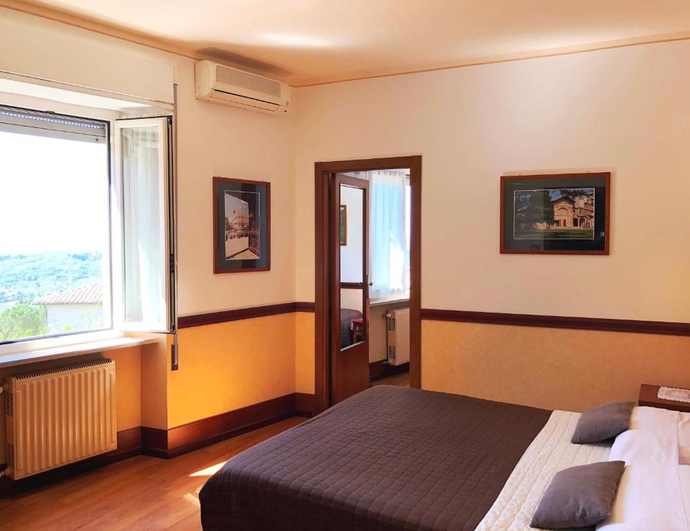 Postel nebo postele na pokoji v ubytování Hotel Signa