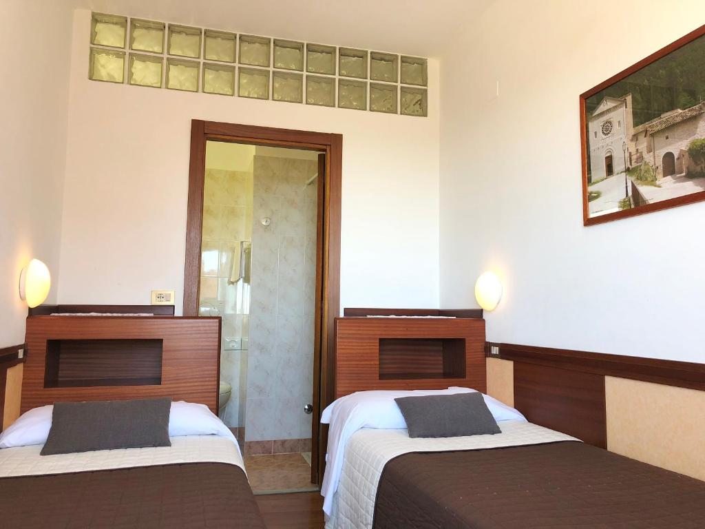 Postel nebo postele na pokoji v ubytování Hotel Signa