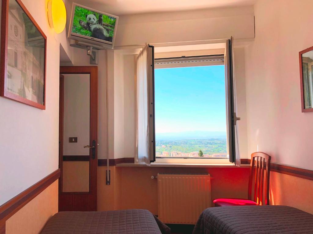 TV a/nebo společenská místnost v ubytování Hotel Signa