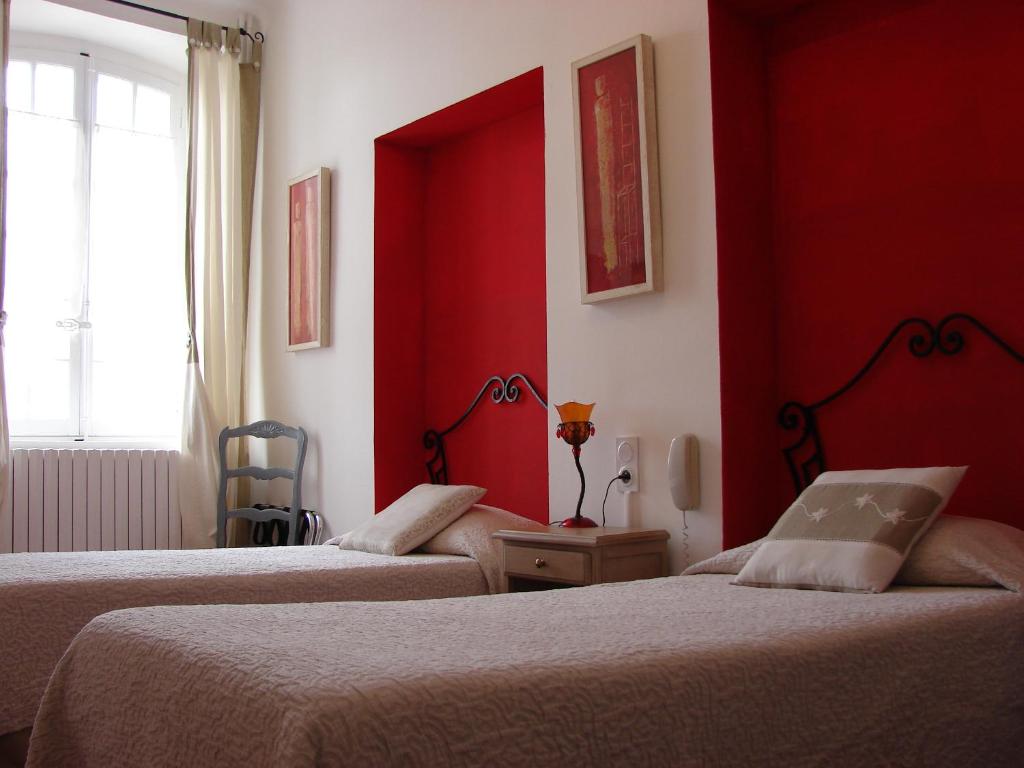 Postel nebo postele na pokoji v ubytování Hôtel Le Siècle