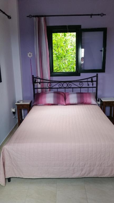 Postel nebo postele na pokoji v ubytování Aloe Villa