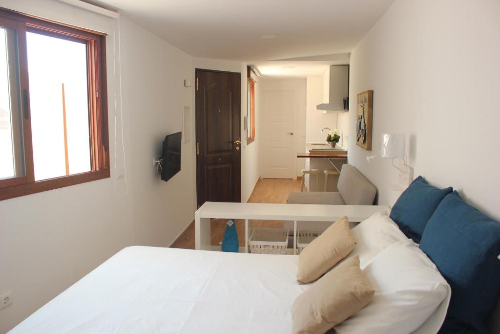 Posteľ alebo postele v izbe v ubytovaní Malaga Center Lagunillas Apartments
