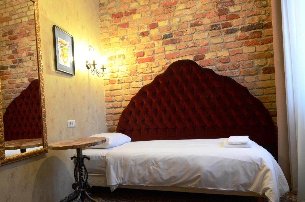 Postel nebo postele na pokoji v ubytování Boutique Hotel Justus