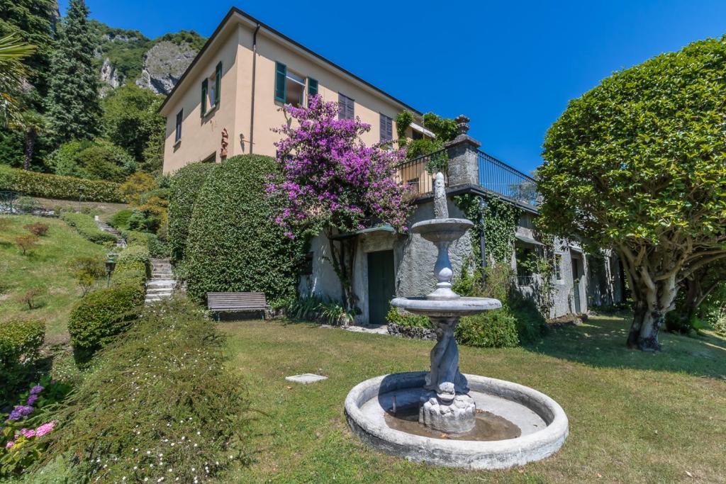 a water fountain in front of a house at Apartment Anna - Griante in Griante Cadenabbia