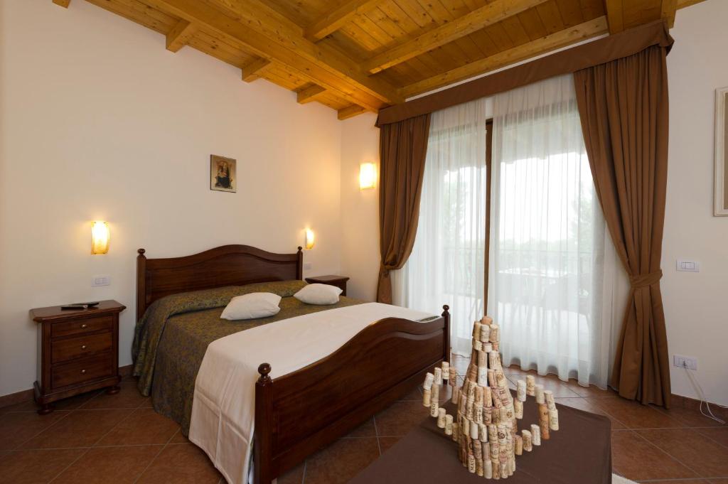 Posteľ alebo postele v izbe v ubytovaní Locanda Ristorante al Cardellino