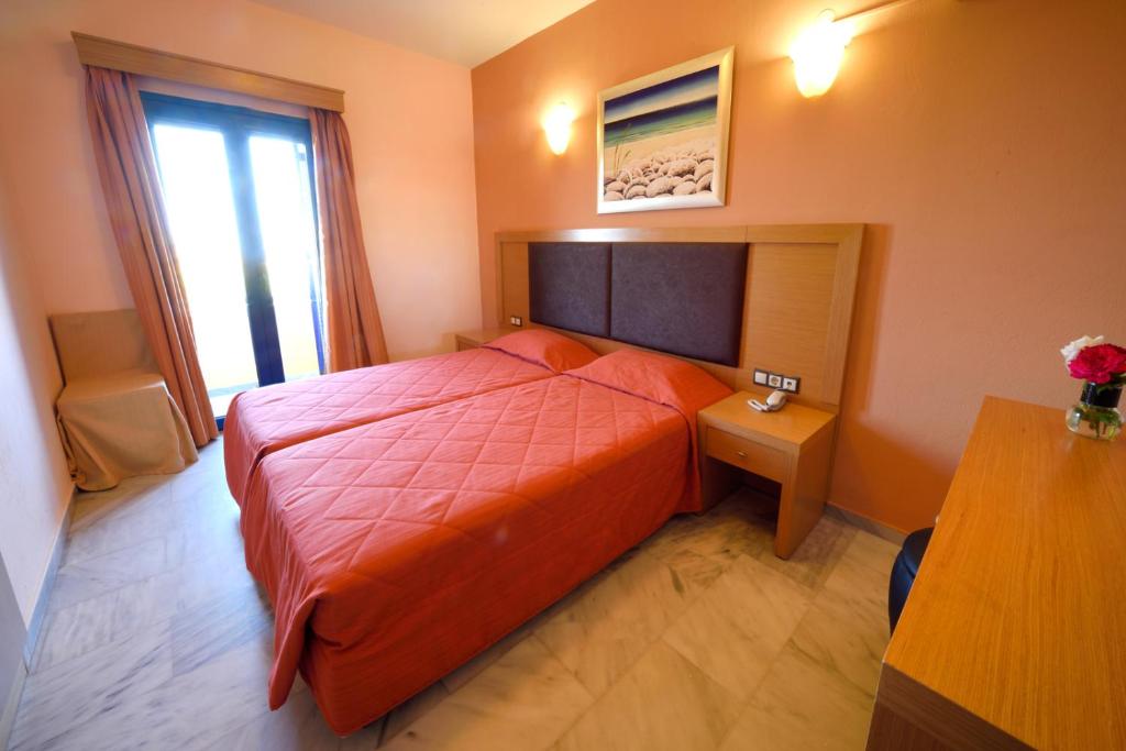 Postel nebo postele na pokoji v ubytování Hotel Palazzo