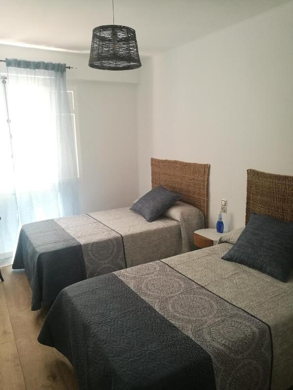 Postel nebo postele na pokoji v ubytování Tirwal Suite