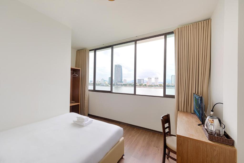 Postel nebo postele na pokoji v ubytování Vitalis Riverside Hotel